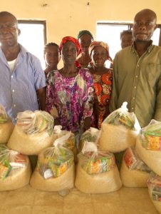 CMN Charity volunteers distributing food packages to grateful families during the December 2025 holiday food drive, spreading hope and compassion.