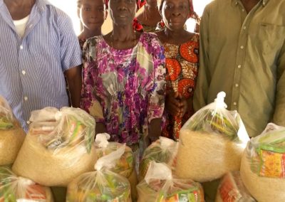 CMN Charity volunteers distributing food packages to grateful families during the December 2025 holiday food drive, spreading hope and compassion.