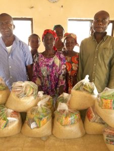 CMN Charity volunteers distributing food packages to grateful families during the December 2025 holiday food drive, spreading hope and compassion.