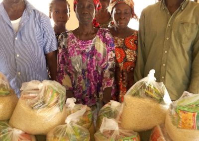 CMN Charity volunteers distributing food packages to grateful families during the December 2025 holiday food drive, spreading hope and compassion.