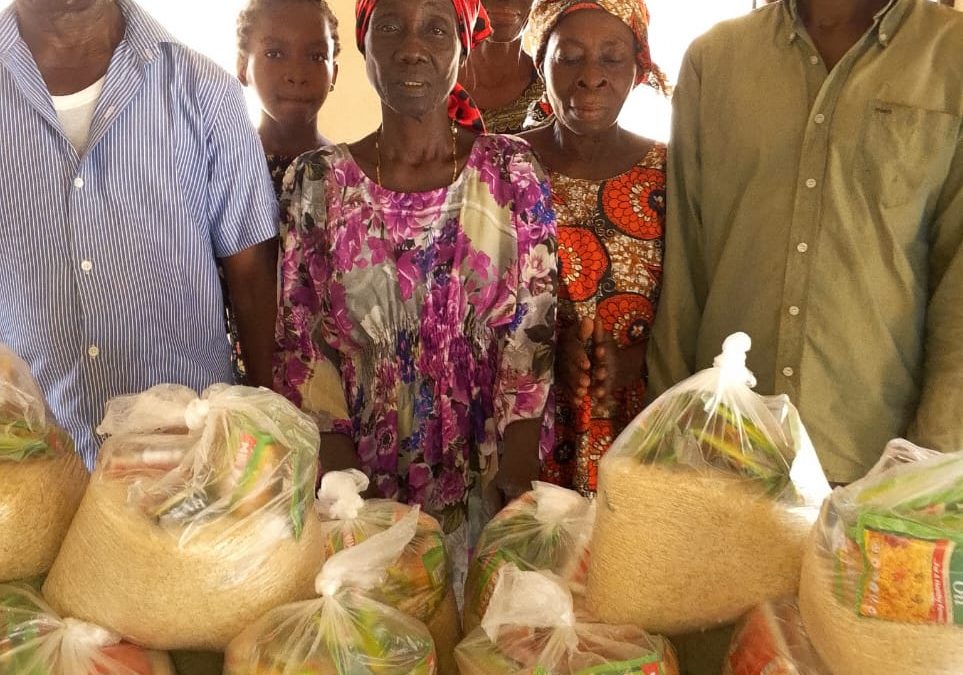 CMN Charity volunteers distributing food packages to grateful families during the December 2025 holiday food drive, spreading hope and compassion.