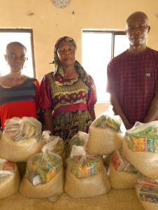CMN Charity volunteers distributing food packages to grateful families during the December 2025 holiday food drive, spreading hope and compassion.