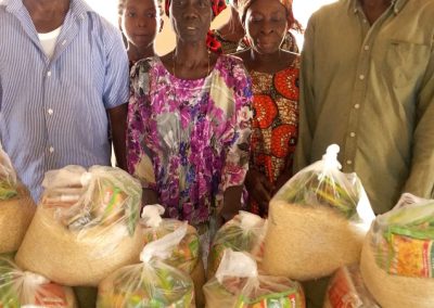 CMN Charity volunteers distributing food packages to grateful families during the December 2025 holiday food drive, spreading hope and compassion.