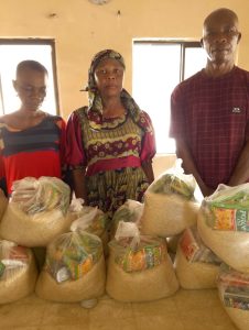 CMN Charity volunteers distributing food packages to grateful families during the December 2025 holiday food drive, spreading hope and compassion.