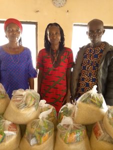 CMN Charity volunteers distributing food packages to grateful families during the December 2025 holiday food drive, spreading hope and compassion.