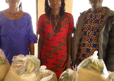 CMN Charity volunteers distributing food packages to grateful families during the December 2025 holiday food drive, spreading hope and compassion.