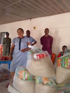 CMN Charity volunteers distributing food packages to grateful families during the December 2025 holiday food drive, spreading hope and compassion.