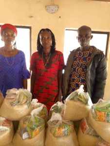 CMN Charity volunteers distributing food packages to grateful families during the December 2025 holiday food drive, spreading hope and compassion.