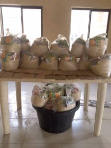 CMN Charity volunteers distributing food packages to grateful families during the December 2025 holiday food drive, spreading hope and compassion.